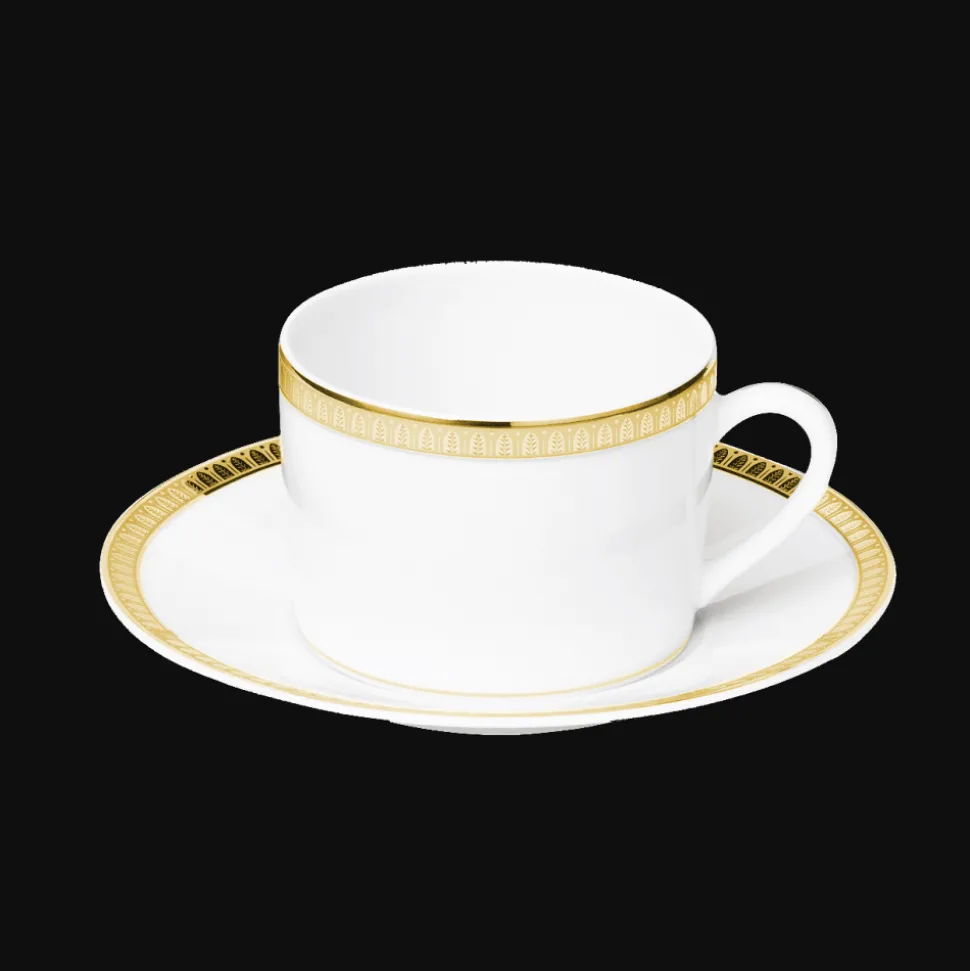 Tasse à thé avec soucoupe en porcelaine finition or